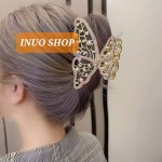 Pinza con forma de mariposa con perlas